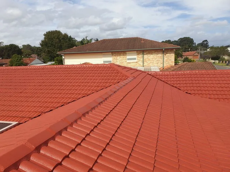 Freshly recoated terracotta tile roof